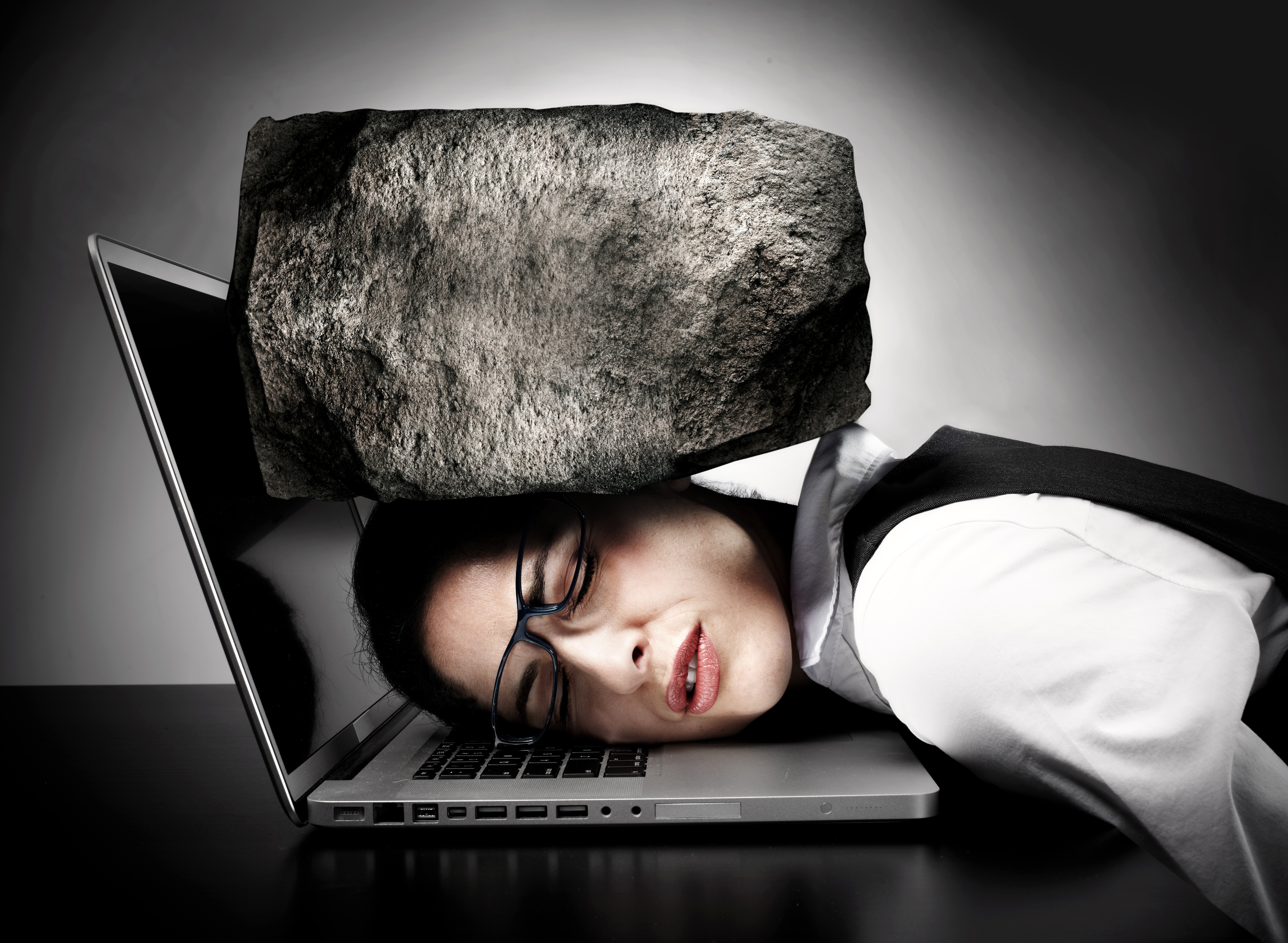 Woman with laptop having stress.